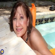 Horny mature lsut playing with her pussy at the pool